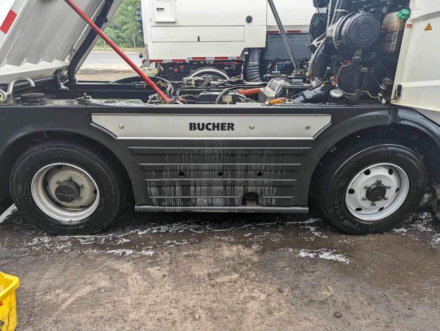 Engine bay and undercarriage deep clean on commercial sweeper
