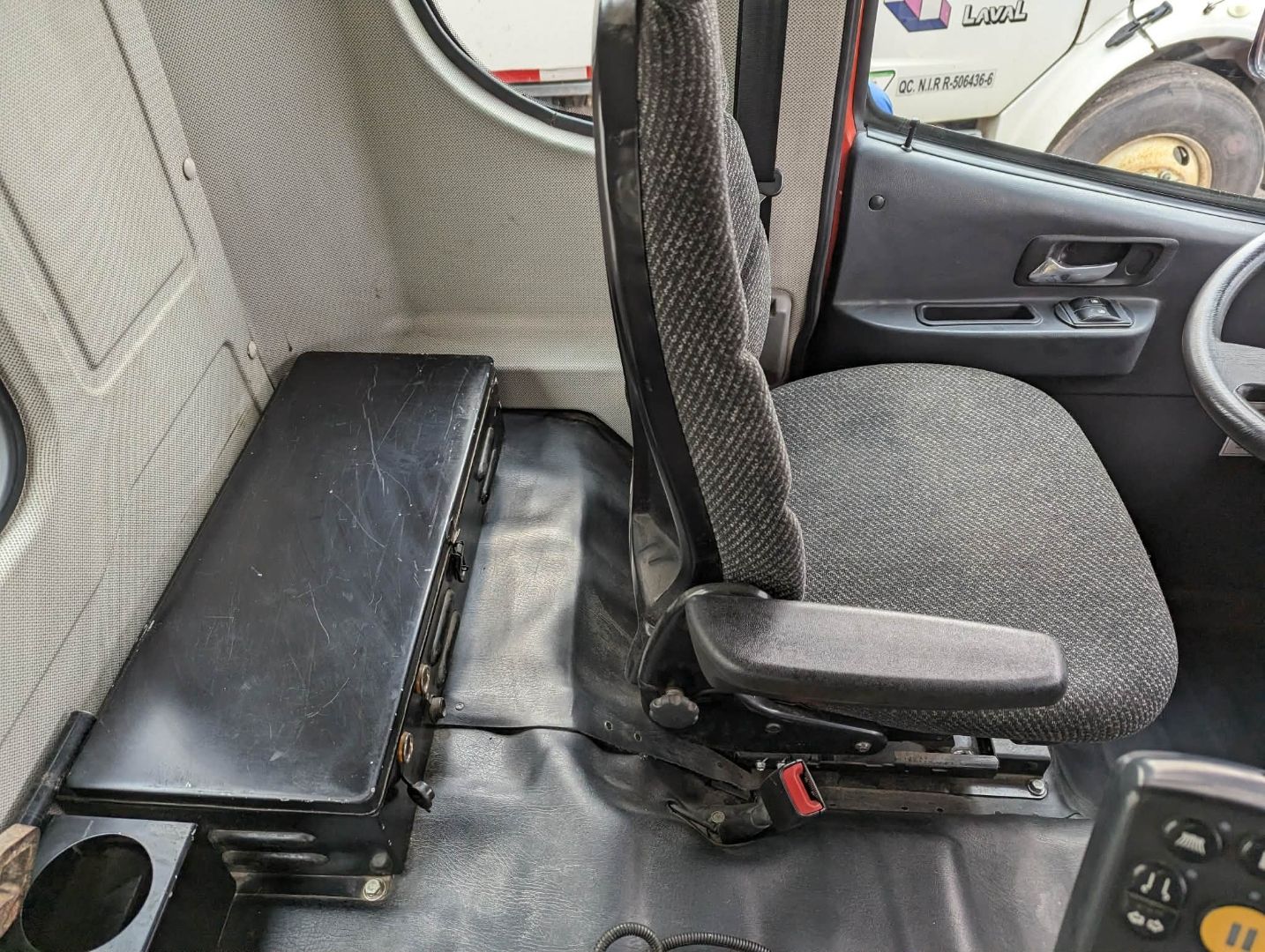 Municipal truck cab — passenger seat after deep clean