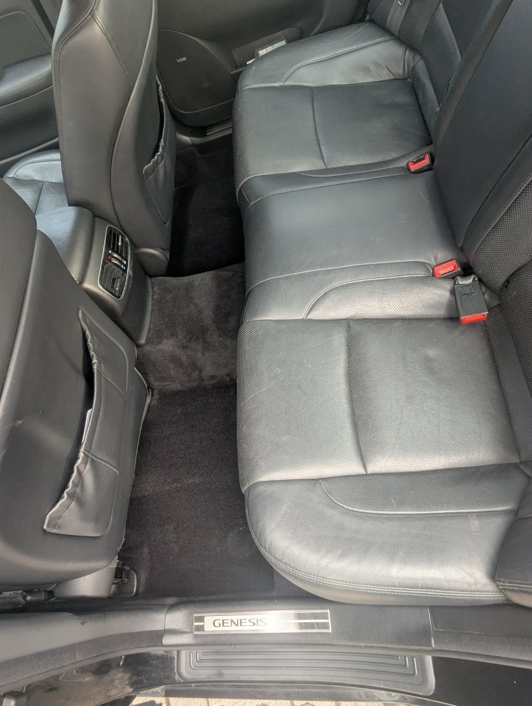 Hyundai Genesis — rear seats clean leather with Genesis badge after interior detail