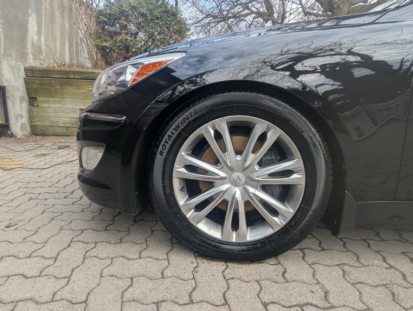 Hyundai Genesis — wheel closeup with clean silver spokes after full detail