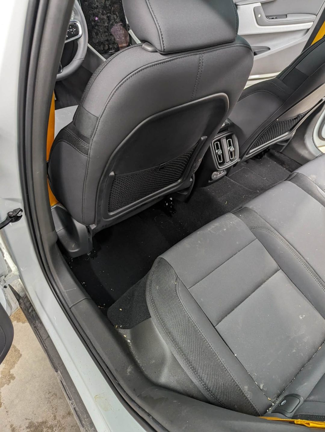 Polestar 2 White — dirty rear carpet before interior detail