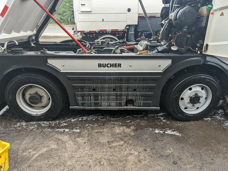 Engine bay and undercarriage deep clean on commercial sweeper