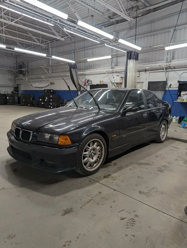 BMW M3 E36 — front 3/4 dusty before exterior detail