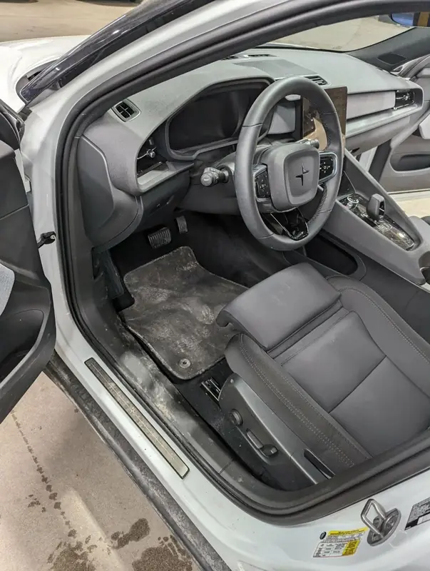 Polestar 2 White — driver side heavily soiled before interior detail
