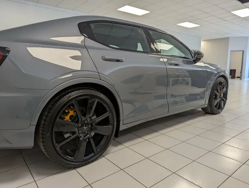 Polestar 2 Grey — side profile on dealership floor after exterior detail