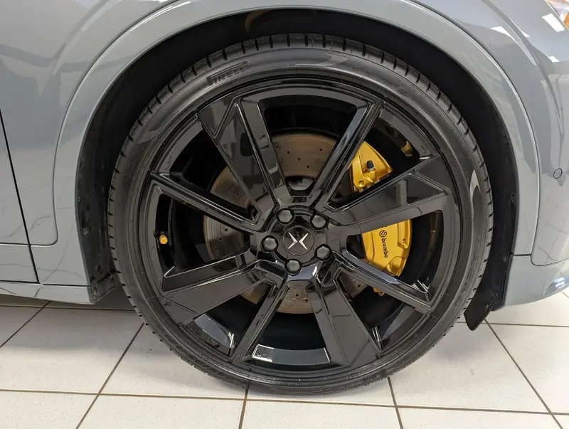 Polestar 2 Grey — wheel closeup with Brembo yellow caliper after exterior detail