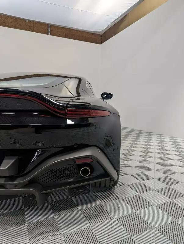Aston Martin Vantage — rear 3/4 studio shot after full detail