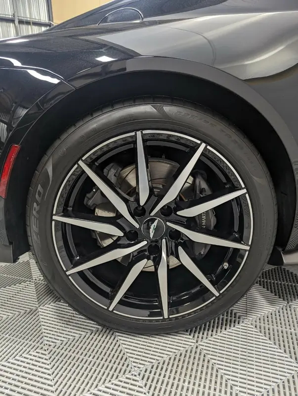 Aston Martin Vantage — wheel closeup with Aston Martin logo after full detail