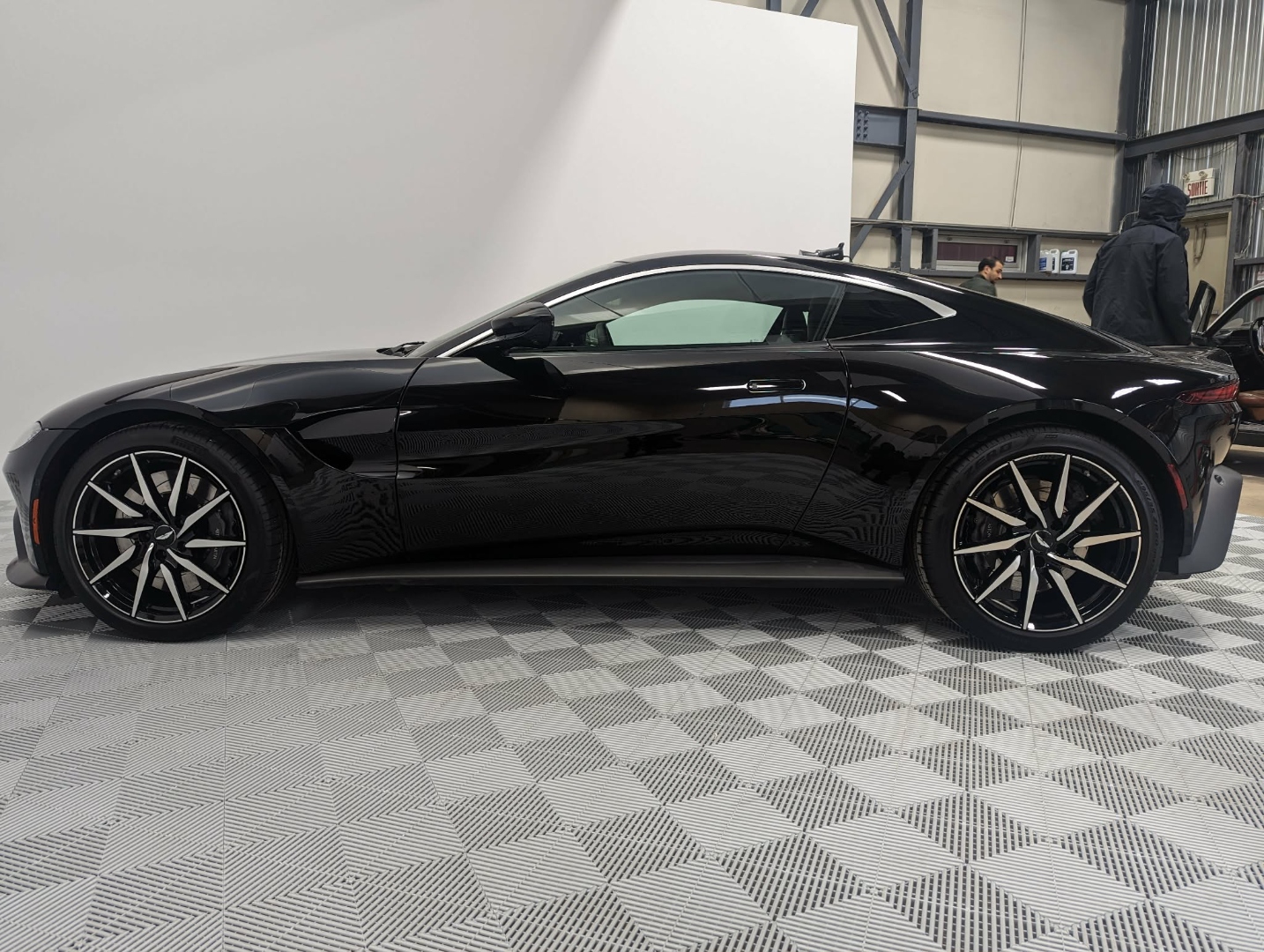 Aston Martin Vantage — full side profile showroom finish after full detail